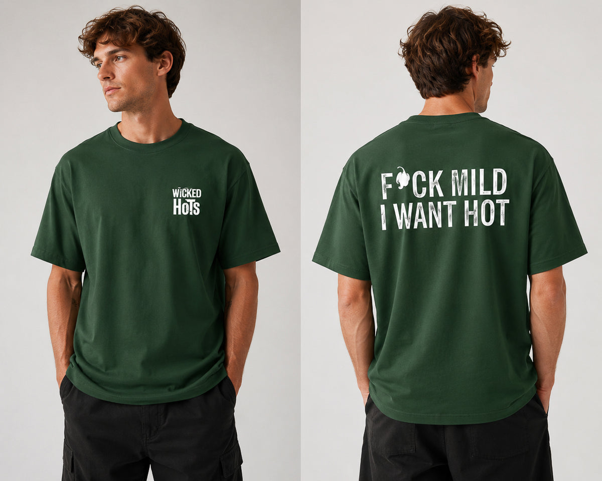 Model wearing green wicked hots fuck mild I want hot t-shirt.  great present for fathers day, mothers day or Christmas for anyone that loves chillies in New Zealand